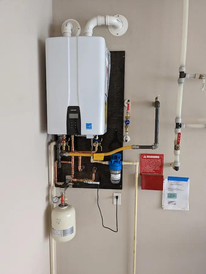 Professional plumber installing copper piping in a Middle home